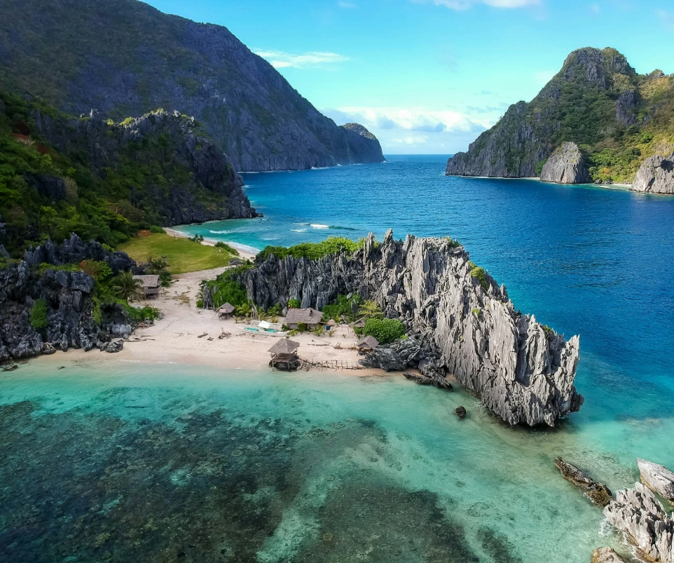 aerial photo of body of water between mountains